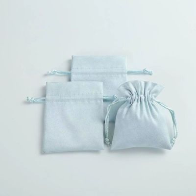 Acceptable OEM/ODM Bolso de cordón de terciopelo azul claro personalizado para la organización de joyería