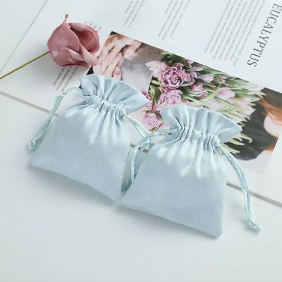 Acceptable OEM/ODM Bolso de cordón de terciopelo azul claro personalizado para la organización de joyería