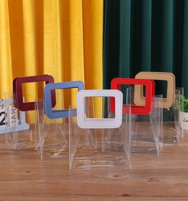 Logotipo personalizado aceptado PVC bolsa de plástico transparente con mango de corte a presión