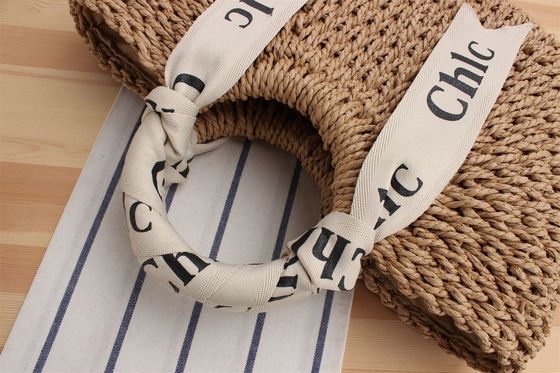 Logotipo personalizado aceptado chaleco de seda bolsa de viaje de vacaciones con material tejido de paja portátil