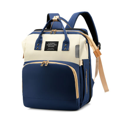 Mochila de pañales de viaje El estilo más moderno con cama de cuna plegable de bebé a prueba de agua