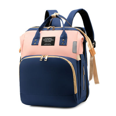 Práctica moda multifunción de gran capacidad impermeable bolso de pañales para bebés mochila con cama