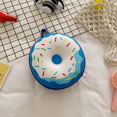 Novedad Bolsa de libros linda 2024 Mochila de dibujos animados Donuts Bolsa escolar de cáscara de goma para la vida cotidiana
