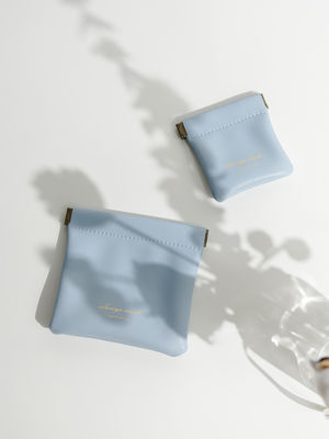 Impresión de logotipo personalizado Bolsa de almacenamiento de cuero de PU pequeña con patrón de letras y logotipo personalizado