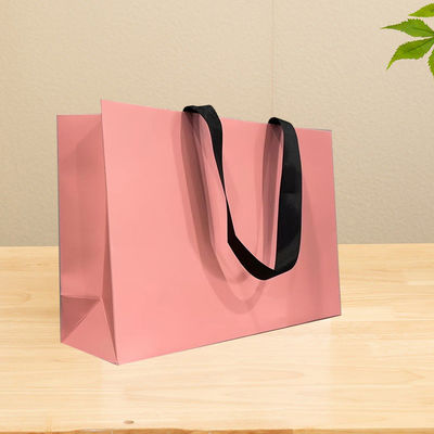 Bolsas de papel impresas personalizadas de cartón Bolsa de regalo de lujo de papel Kraft blanco para bolsas de compras