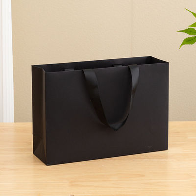 Bolsas de papel impresas personalizadas de cartón Bolsa de regalo de lujo de papel Kraft blanco para bolsas de compras