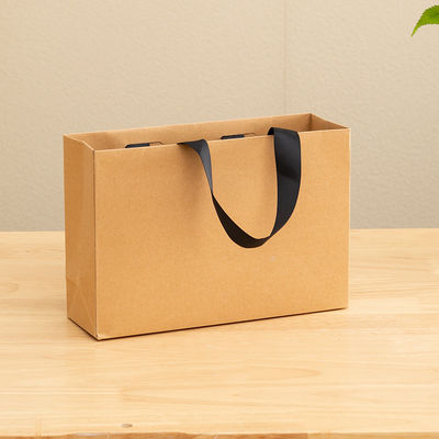 Bolsas de papel impresas personalizadas de cartón Bolsa de regalo de lujo de papel Kraft blanco para bolsas de compras