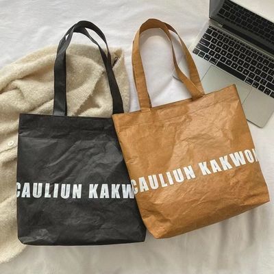 Bolso de mano unisex de papel kraft limpiable con logotipo personalizado y mango único