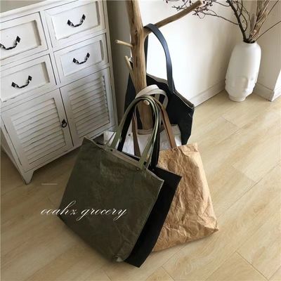 Bolso de mano unisex de papel kraft limpiable con logotipo personalizado y mango único