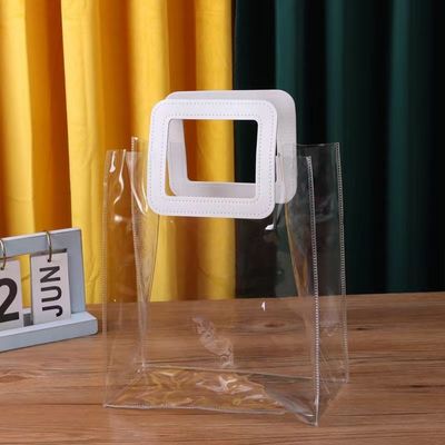 Bolsa de toque transparente de PVC con mango de cuero para embalaje de regalo con logotipo personalizado