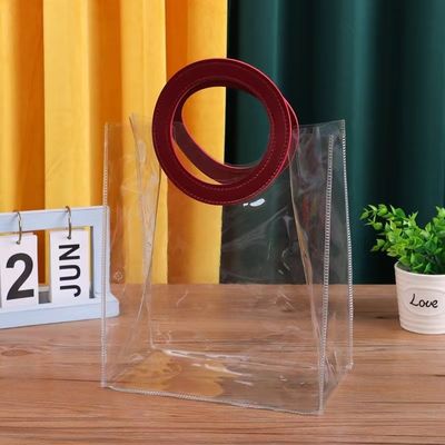 Bolsa de toque transparente de PVC con mango de cuero para embalaje de regalo con logotipo personalizado