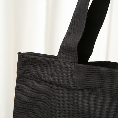 Bolso de algodón de lona de color negro ecológico con logotipo impreso personalizado