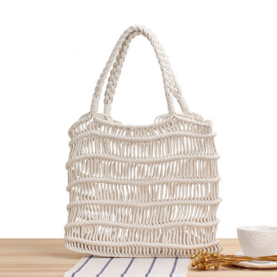 Color personalizado Verano 2022 Mujeres hechas a mano Bolso de paja hueco Bolso de mano de playa tejido