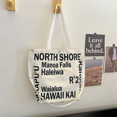 Las mujeres más modernas de lienzo bolso crossbody con mango de toque y patrón de letra