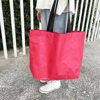 Bolsa de compras de papel Dupont en color personalizado con material impermeable y lavable