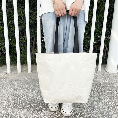 Bolsa de compras de papel Dupont en color personalizado con material impermeable y lavable