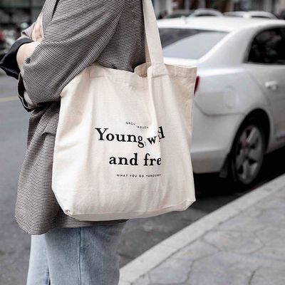 Bolsas personalizadas de color de algodón con estilo manipulado y logotipo de la empresa impreso