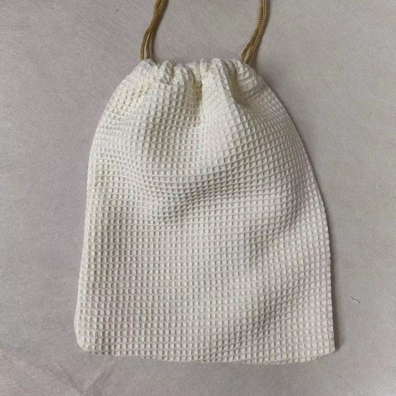 Producto OEM/ODM aceptado Bolsa de almacenamiento cosmético de tejido de gofres en blanco para necesidades de cuidado de la piel