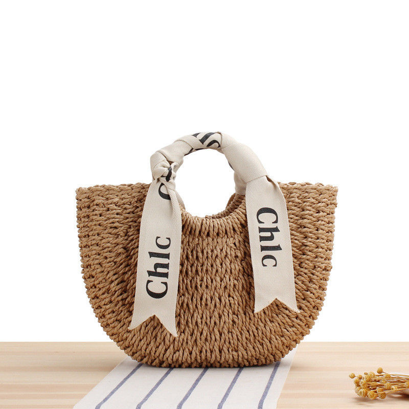 Logotipo personalizado aceptado chaleco de seda bolsa de viaje de vacaciones con material tejido de paja portátil