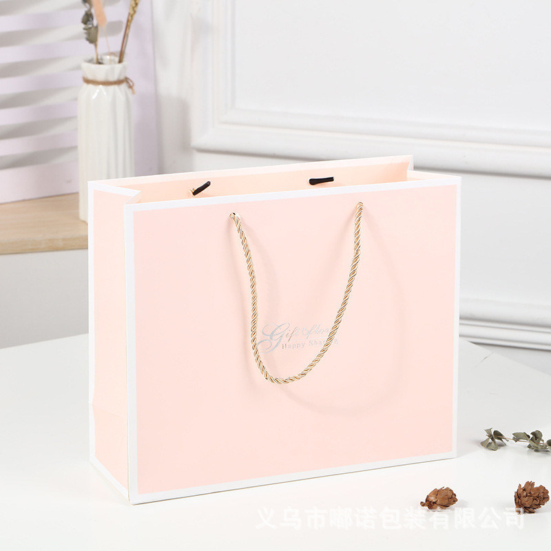 Bolso de compras impreso a medida de cartón Bolso de regalo de papel kraft blanco de lujo con mango de cinta