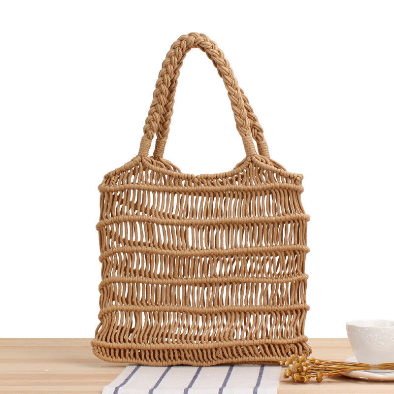 Color personalizado Verano 2022 Mujeres hechas a mano Bolso de paja hueco Bolso de mano de playa tejido