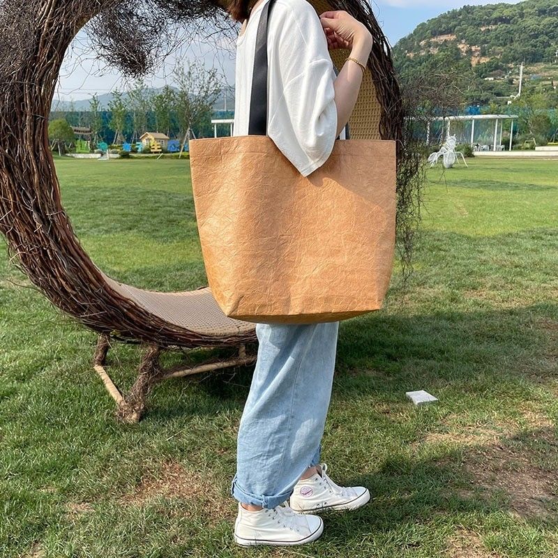 Bolsa de compras de papel Dupont en color personalizado con material impermeable y lavable