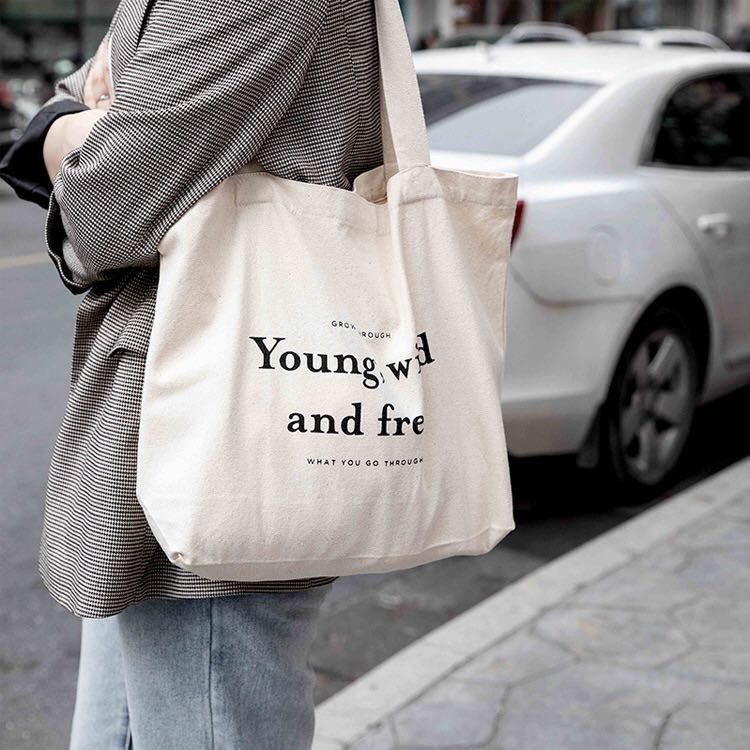 Bolsas personalizadas de color de algodón con estilo manipulado y logotipo de la empresa impreso
